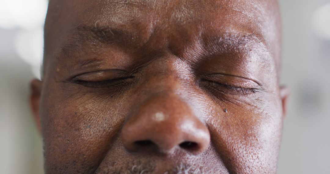 Close-Up of Elderly African American Man with Eyes Closed - Free Images, Stock Photos and Pictures on Pikwizard.com