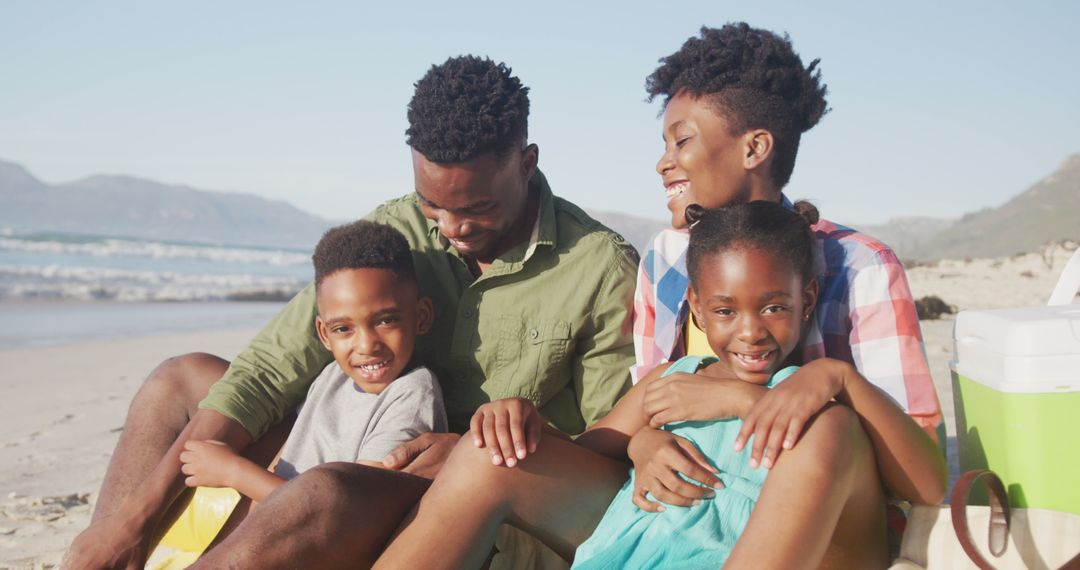 Cheerful Family Enjoying Beach Vacation Together