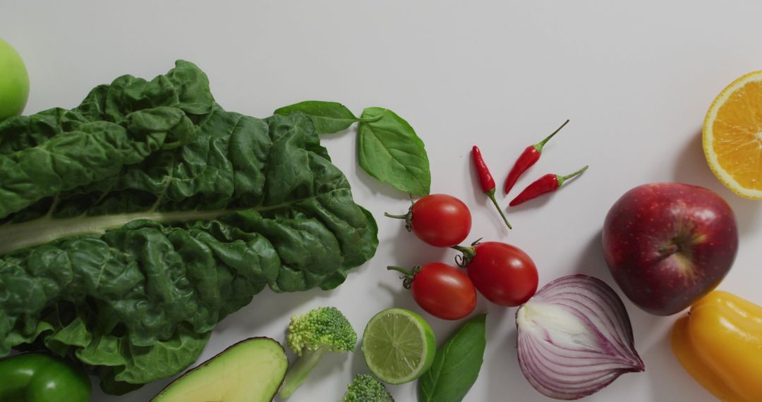 Assortment of Fresh Fruits and Vegetables on White Surface