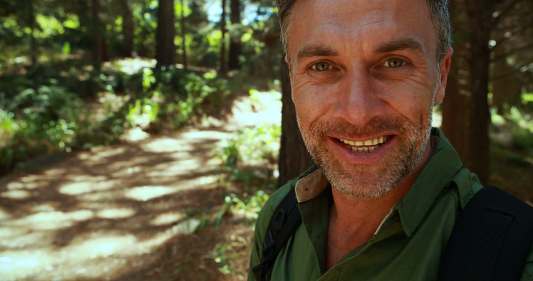 Happy Middle-aged Adventurer Exploring Sunlit Forest