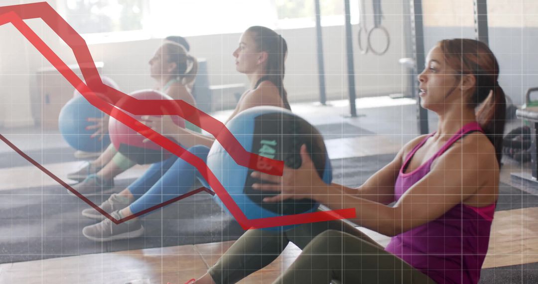 Women Exercising with Medicine Balls in Gym Setting with Data Overlay