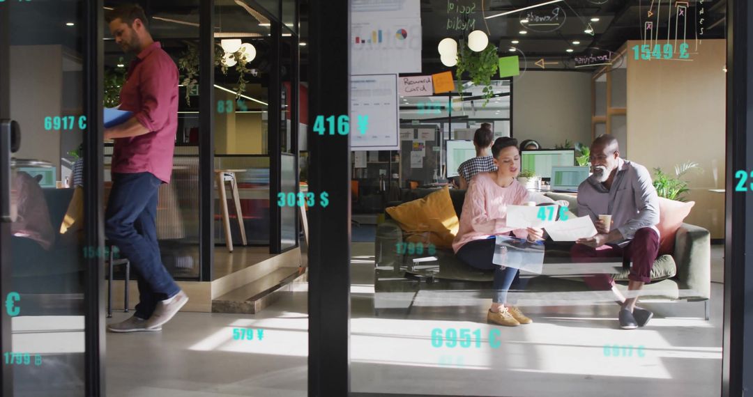 Diverse Team Collaborating in Modern Office with Financial Data