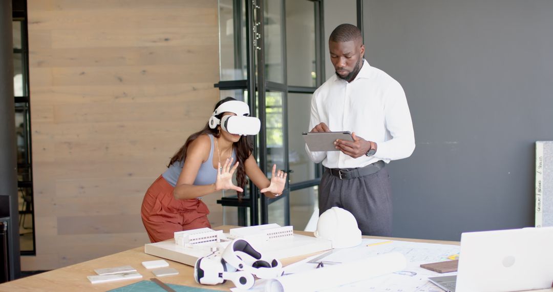 Architectural Team Using VR Headset for Virtual Model Interaction