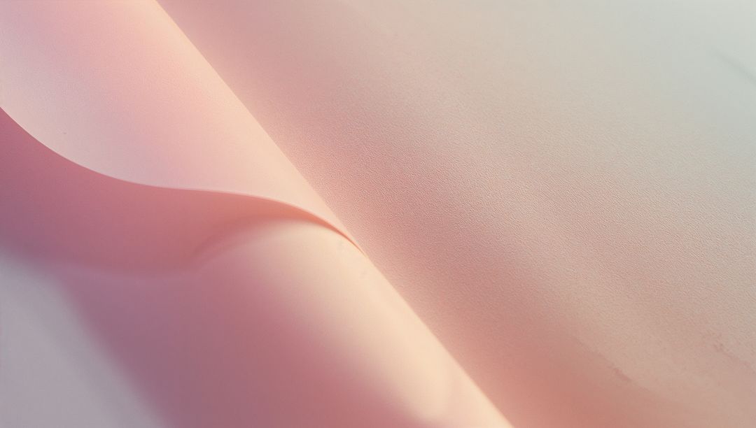 Folded Pastel Pink Sheet Creating Smooth Curves