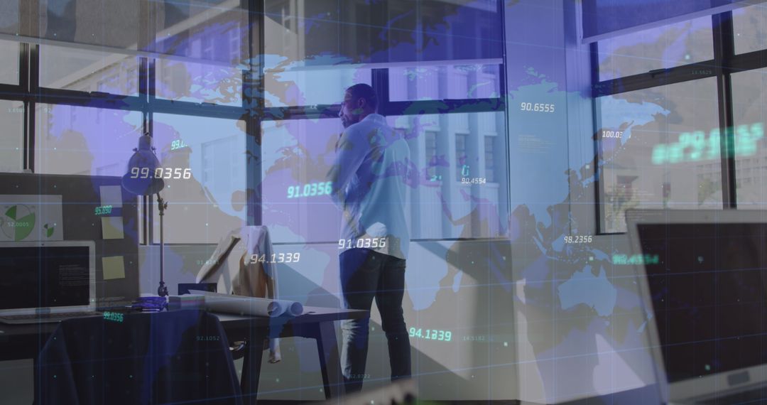 Businessman Analyzing Financial Data with World Map Overlay
