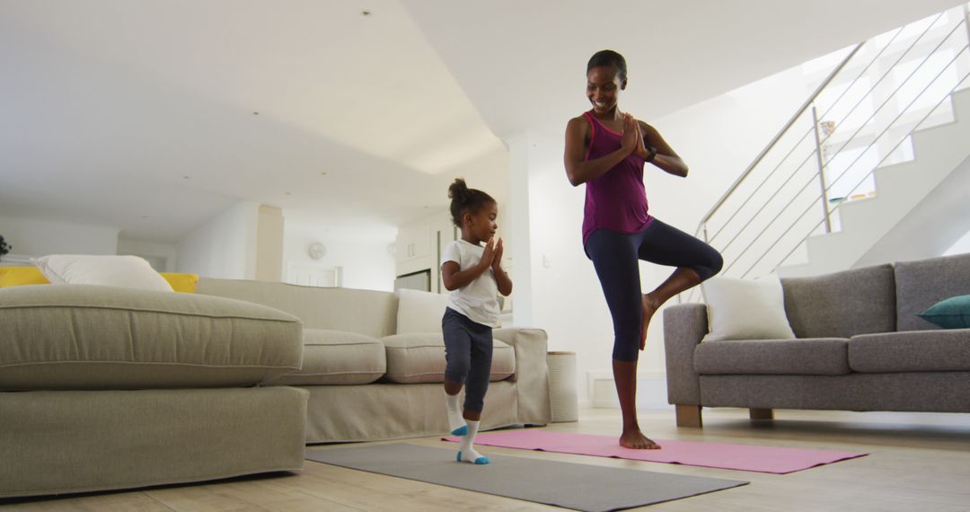 Mother and Daughter Enjoying Yoga at Home - Free Images, Stock Photos and Pictures on Pikwizard.com