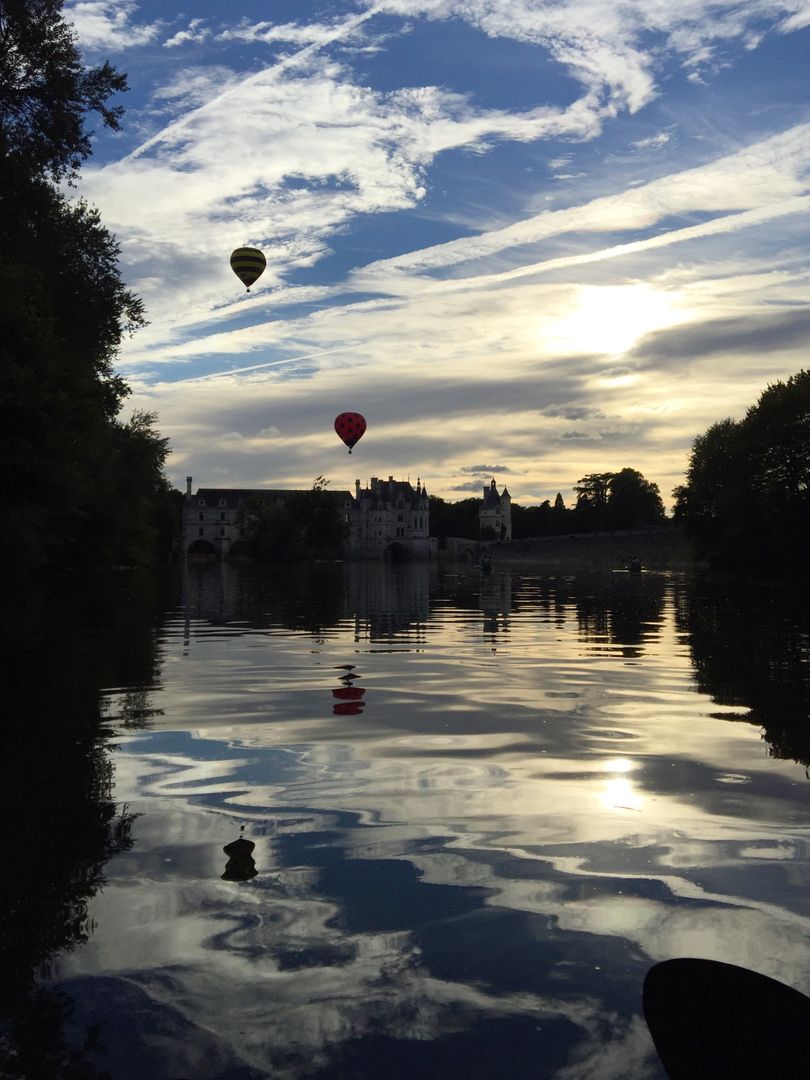 Hot Air Balloons Reflecting on Tranquil Lake at Sunset - Free Images, Stock Photos and Pictures on Pikwizard.com