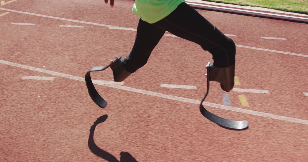 Athlete with Prosthetic Legs Running on Track - Free Images, Stock Photos and Pictures on Pikwizard.com
