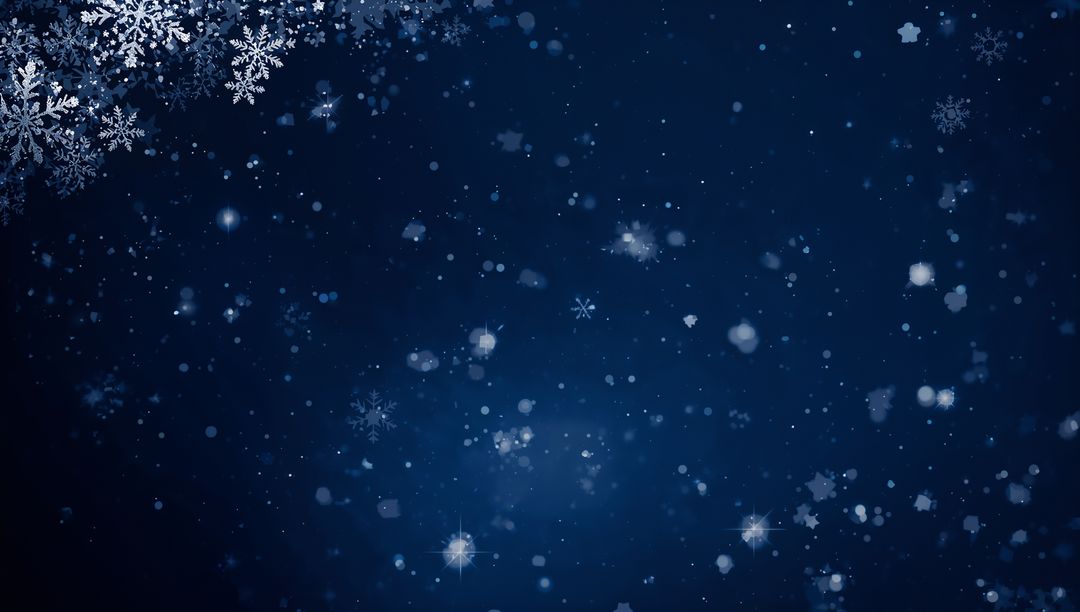 Floating lacy snowflakes and soft bokeh on deep blue night background with star sparkles