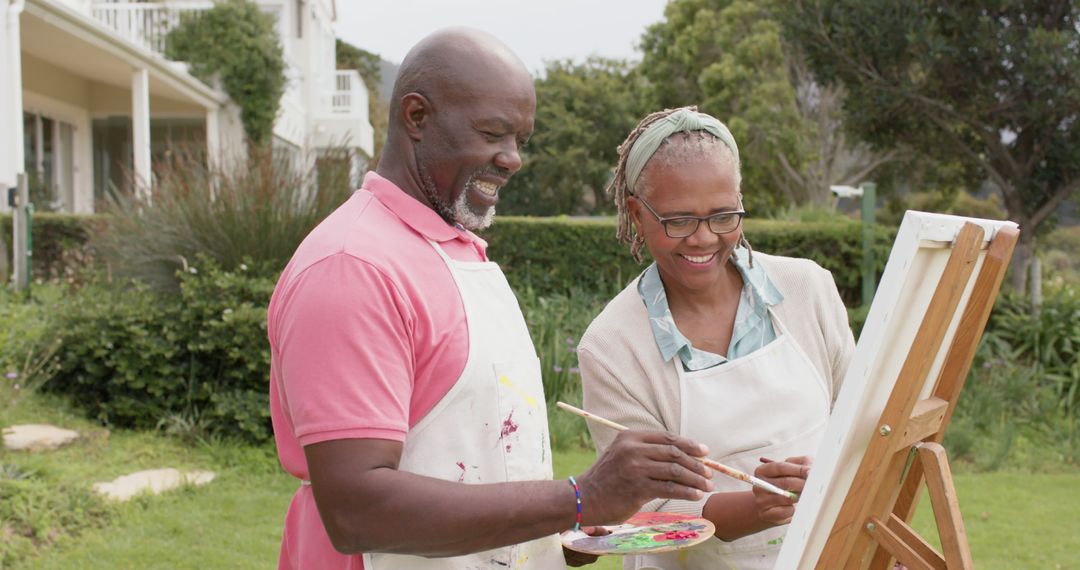 Senior African American couple painting together outdoors with smiles - Free Images, Stock Photos and Pictures on Pikwizard.com