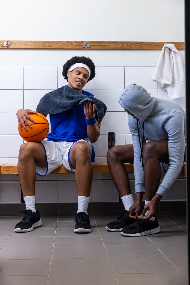 Basketball Players Connecting in Locker Room Before Game