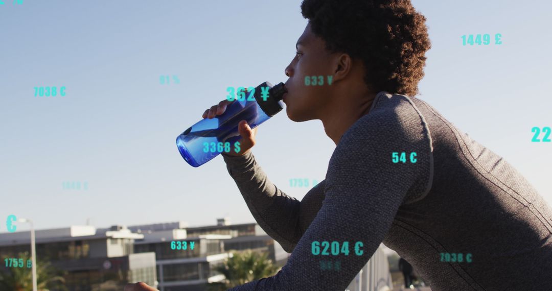 Athlete Drinking Amid Overlay of Finance and Fitness Metrics