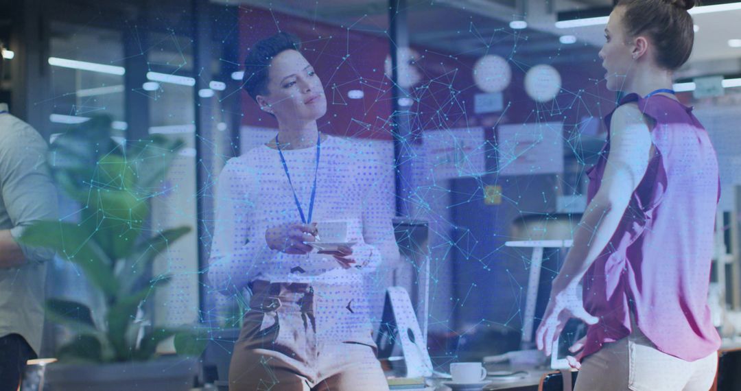 Modern Business Women Discussing with Digital Overlay in Open Office