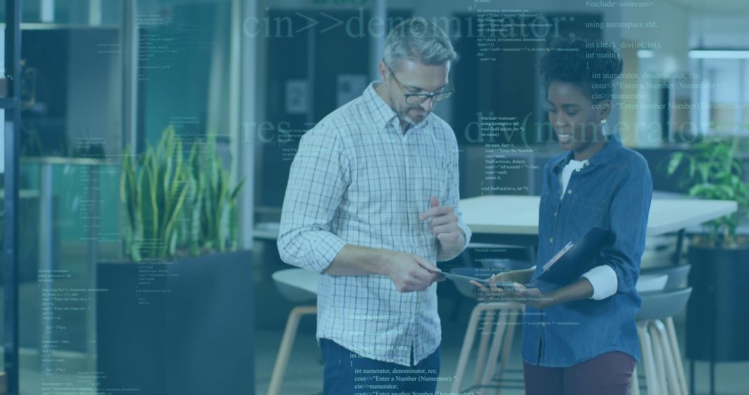 Professionals Analyzing Data on Tablet in Modern Office Workspace