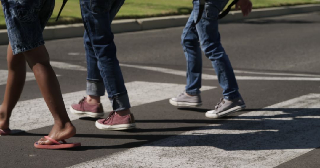 Feet of Teenagers Crossing Street at Pedestrian Crosswalk - Free Images, Stock Photos and Pictures on Pikwizard.com