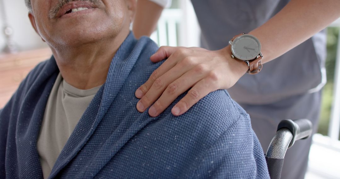 Healthcare Worker Caring for Elderly Patient in Wheelchair - Free Images, Stock Photos and Pictures on Pikwizard.com