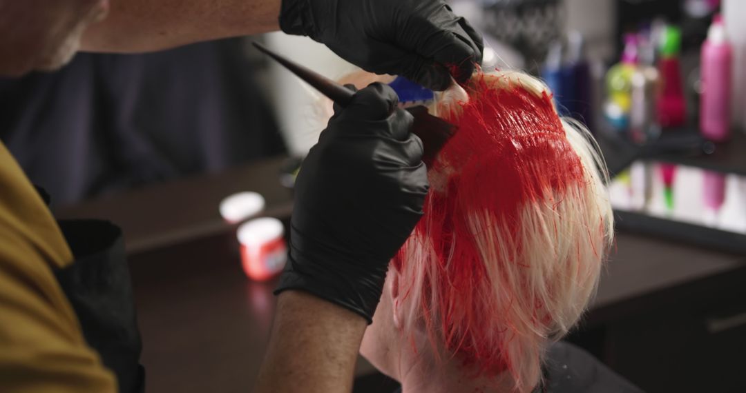 Hairdresser Applying Red Dye on Blonde Hair in Salon - Free Images, Stock Photos and Pictures on Pikwizard.com