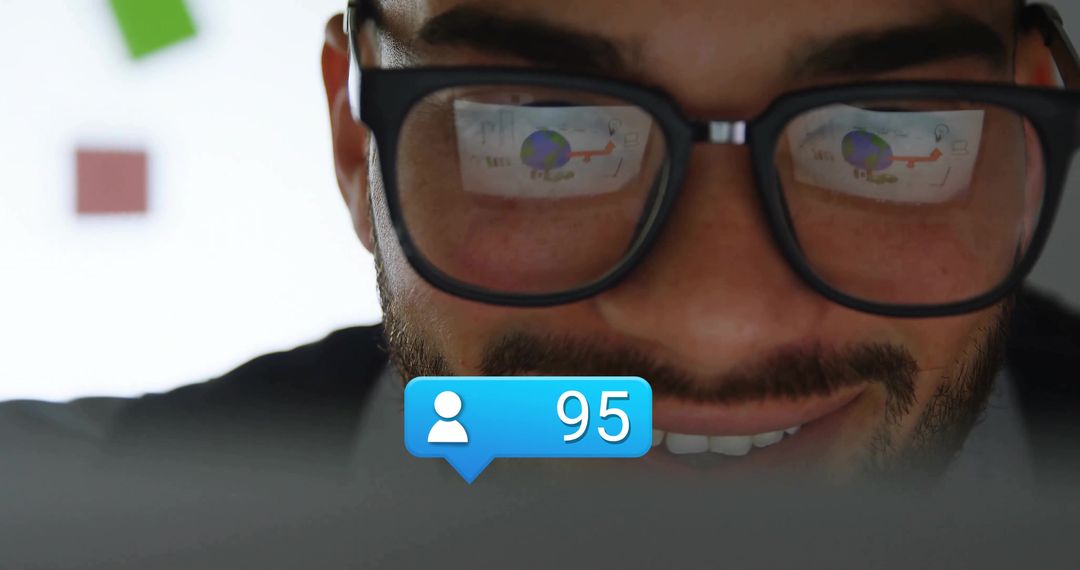 Man Analyzing Data on Laptop with Social Notification Alert