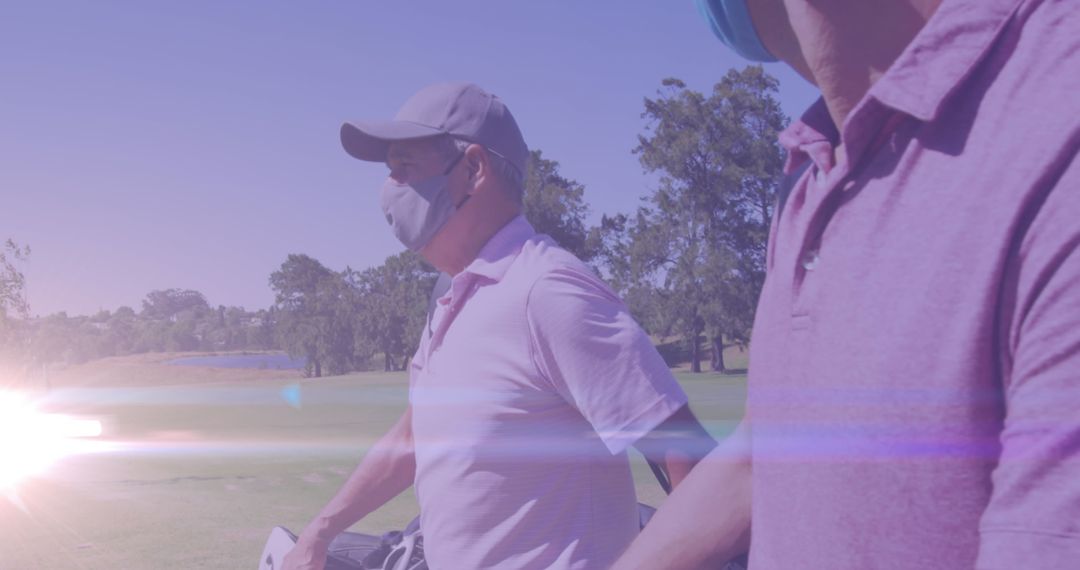Male Golfers Enjoying a Game with Masks on Sunny Day