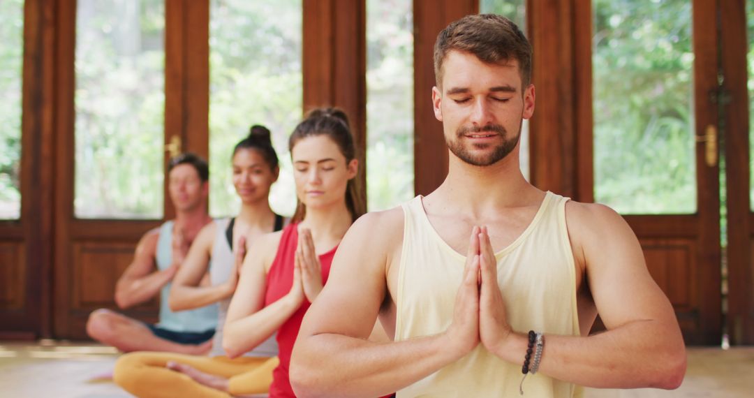 Diverse Group Practicing Yoga with Focused Calmness