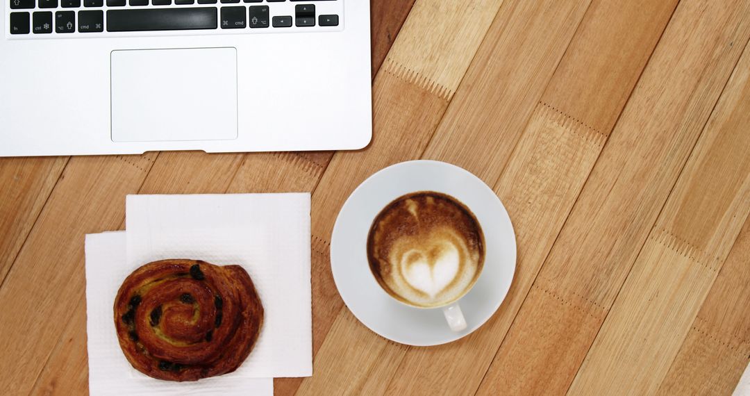 Open Laptop with Coffee and Pastry on Wooden Desk - Free Images, Stock Photos and Pictures on Pikwizard.com