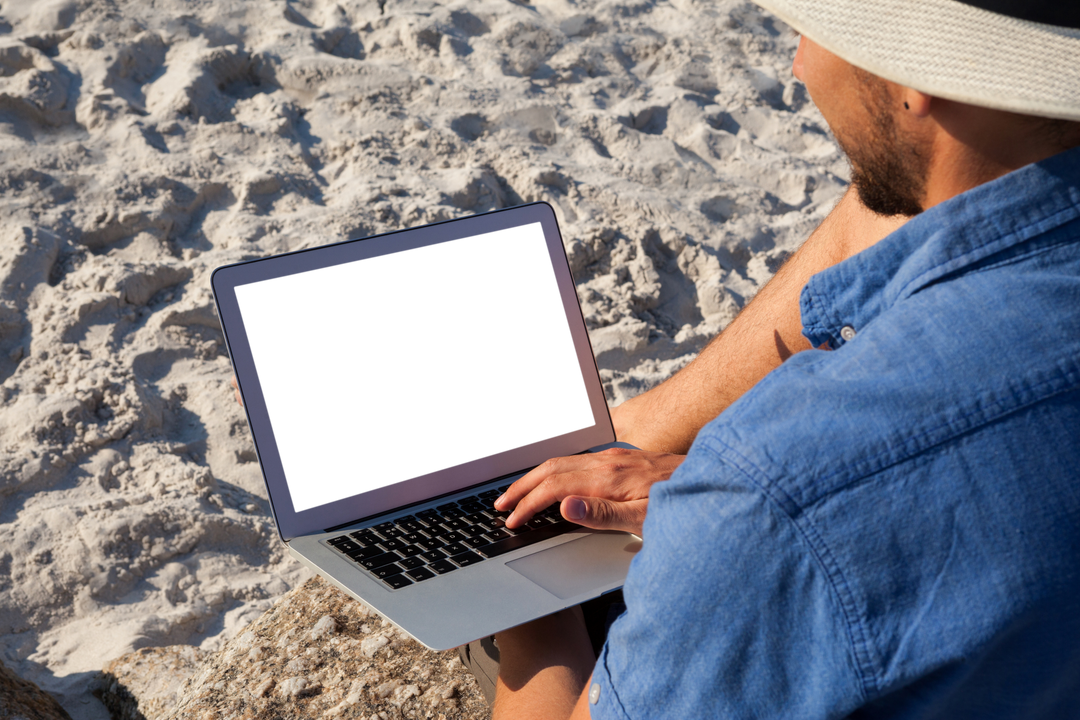 Man Using Transparent Screen Laptop on Beach During Sunny Day - Download Free Stock Images Pikwizard.com