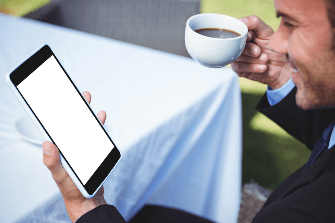 Smiling Young Man With Transparent Tablet and Coffee