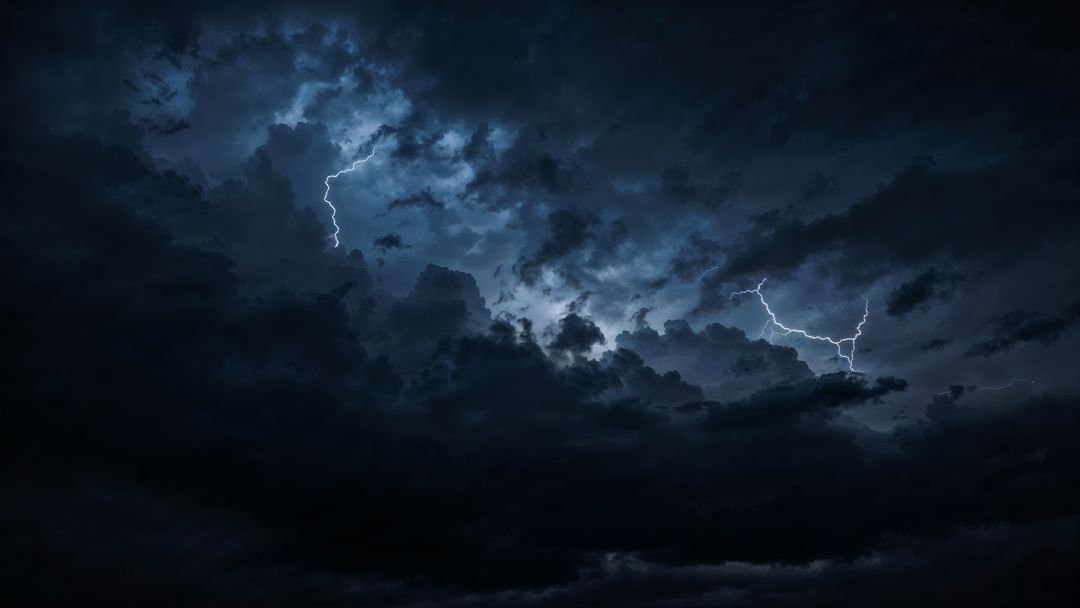 Dramatic negative energy night sky with lightning and storm clouds