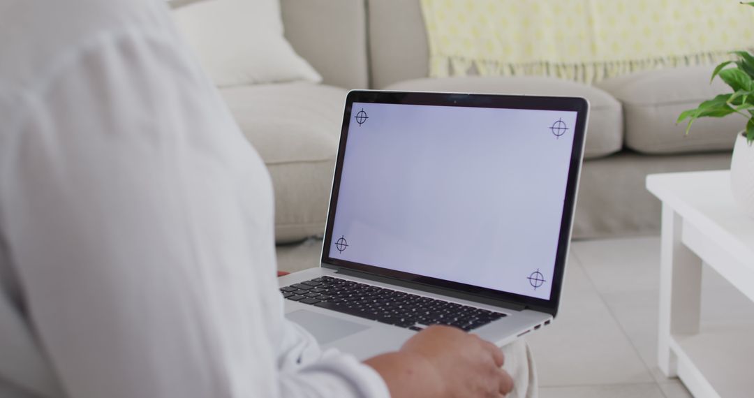 Person Working on a Laptop with a Blank Screen - Free Images, Stock Photos and Pictures on Pikwizard.com