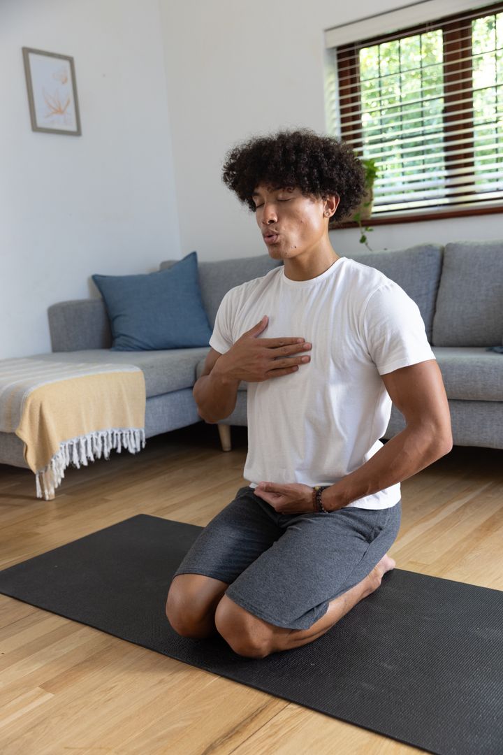 Man Engaged in Mindful Meditation Indoor Exercise at Home
