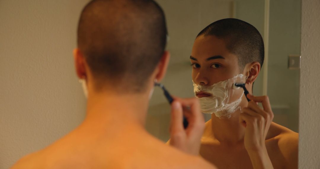 Young Man Shaving in Bathroom Mirror - Free Images, Stock Photos and Pictures on Pikwizard.com