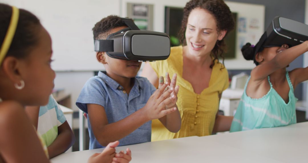 Teacher guiding children using VR headsets in classroom - Free Images, Stock Photos and Pictures on Pikwizard.com