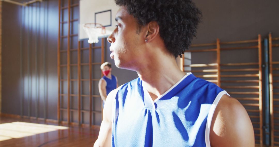 African American Basketball Player Focusing in Indoor Court - Free Images, Stock Photos and Pictures on Pikwizard.com