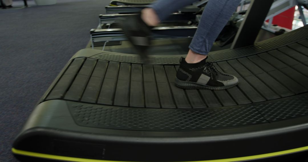 Close-Up of Person Running on Treadmill in Gym - Free Images, Stock Photos and Pictures on Pikwizard.com