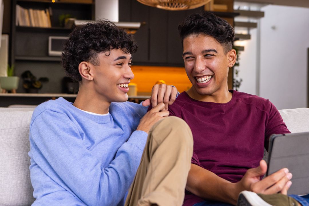 Two Friends Enjoying Technology in a Modern Home Setting