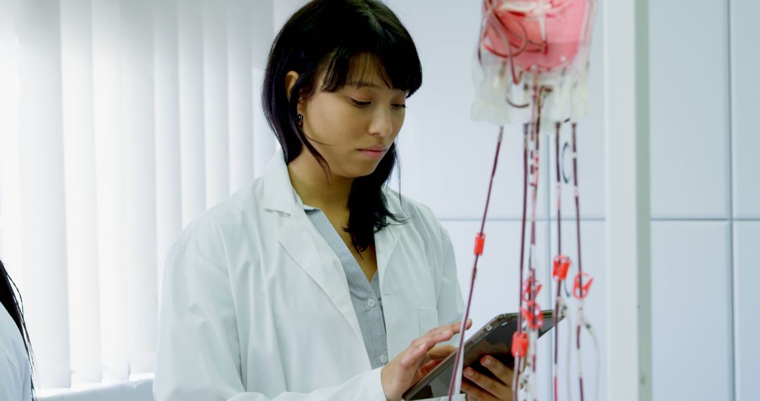 Female Scientist Working in a Laboratory with Medical Equipment - Free Images, Stock Photos and Pictures on Pikwizard.com