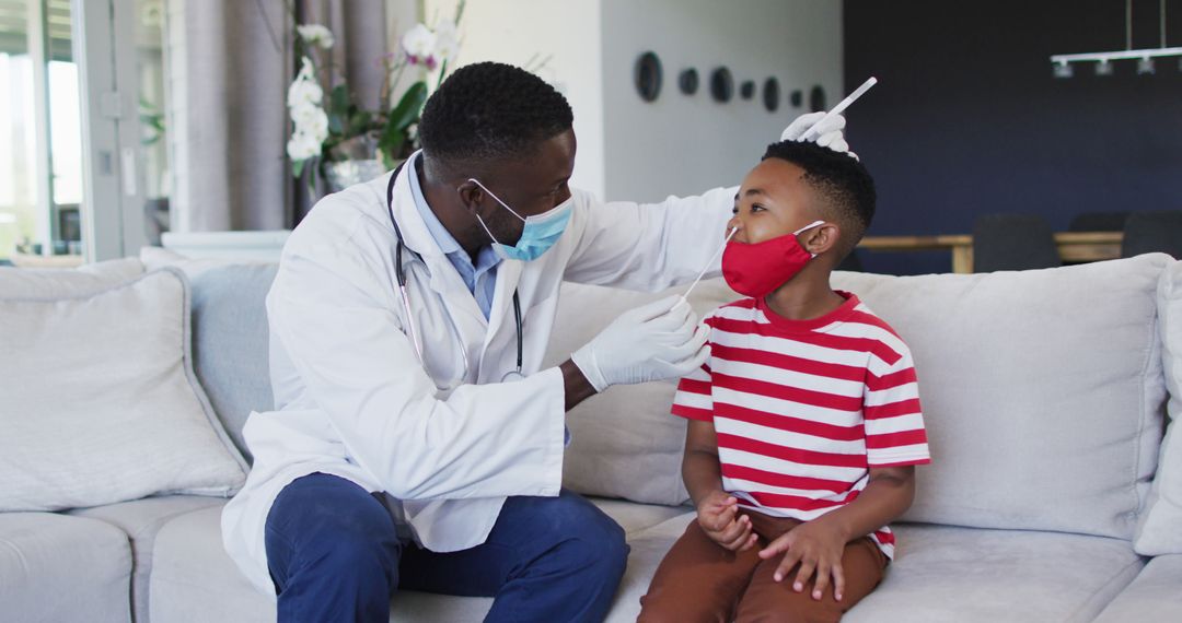 Doctor Examining Young Boy's Throat at Home Visit - Free Images, Stock Photos and Pictures on Pikwizard.com