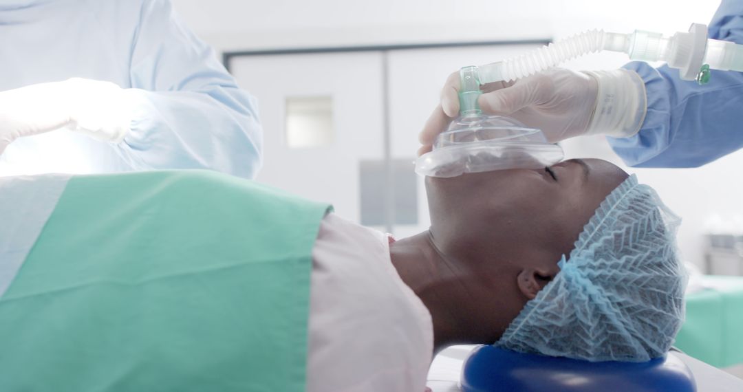 African American Patient in Operating Room Undergoing Anesthesia - Free Images, Stock Photos and Pictures on Pikwizard.com