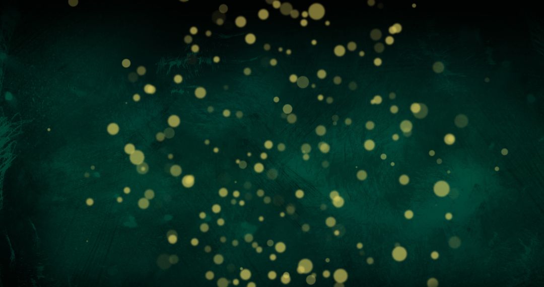 Golden Particles Floating on Emerald Background