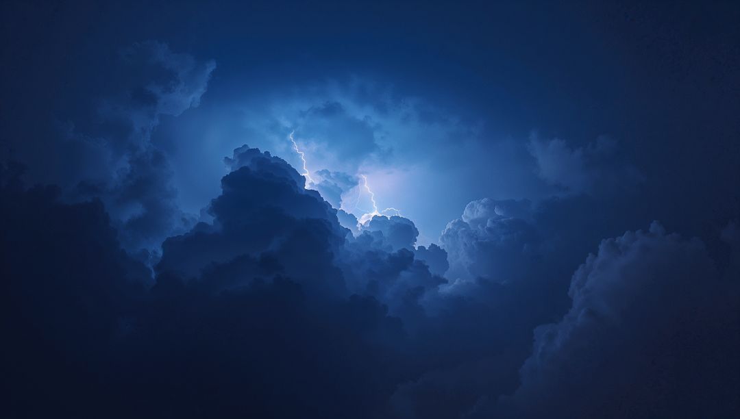 Dramatic Nighttime Thunderstorm with Illuminated Clouds