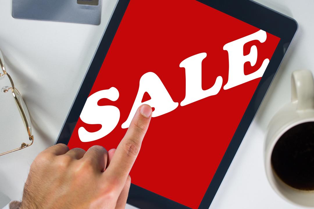 Shopper Tapping Tablet Displaying Bold Red Sale Announcement - Free Images, Stock Photos and Pictures on Pikwizard.com