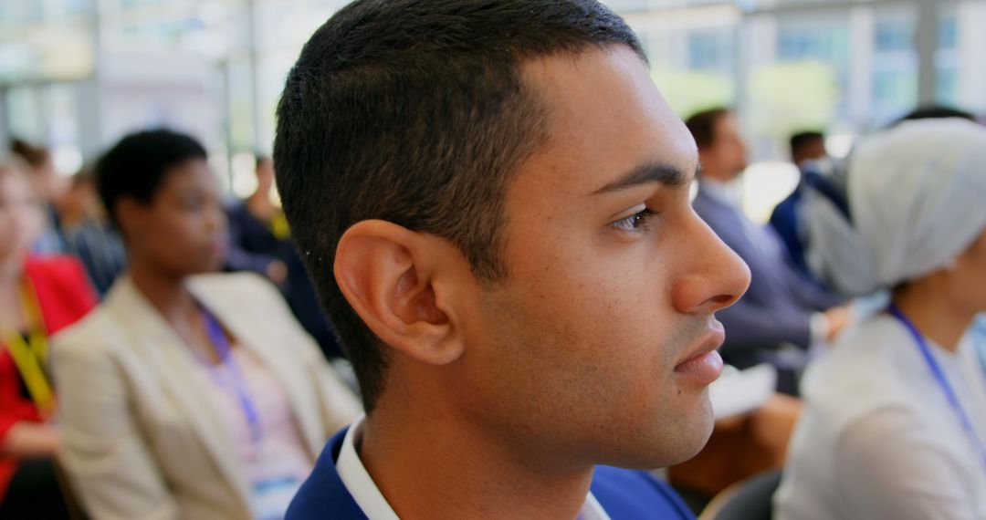 Focused Young Professional Attending Conference in Thoughtful Pose