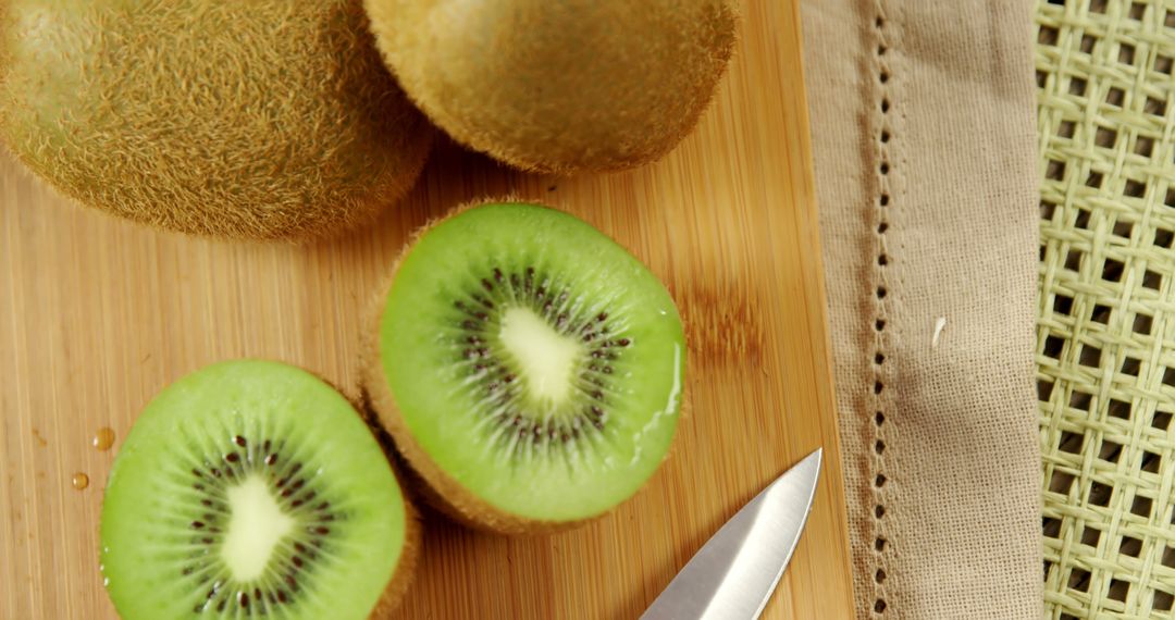 Fresh Sliced Kiwi Fruit on Wooden Cutting Board - Free Images, Stock Photos and Pictures on Pikwizard.com