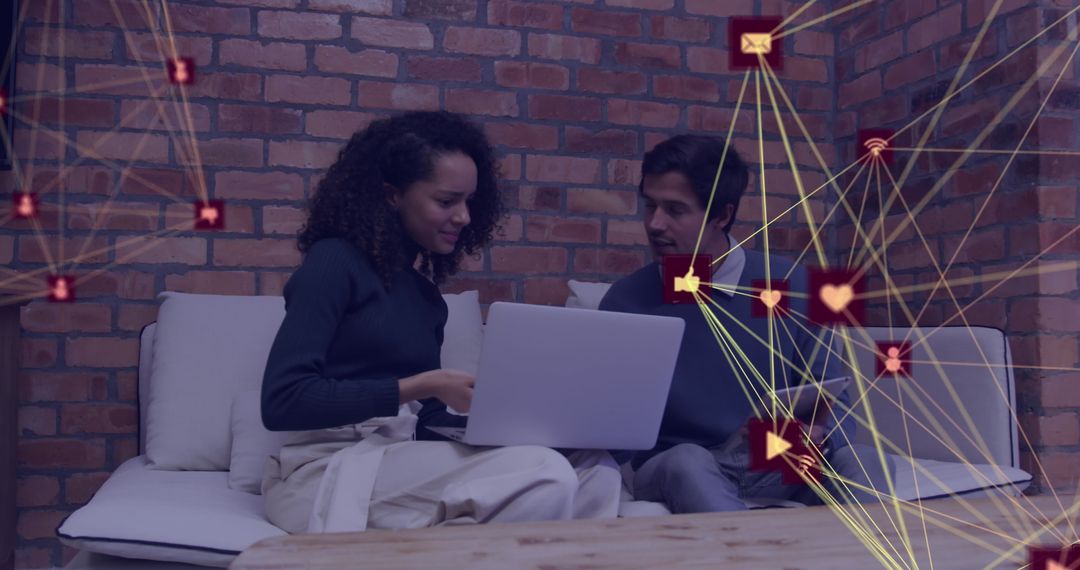 Colleagues Collaborating on Digital Strategy with Overlay Icons