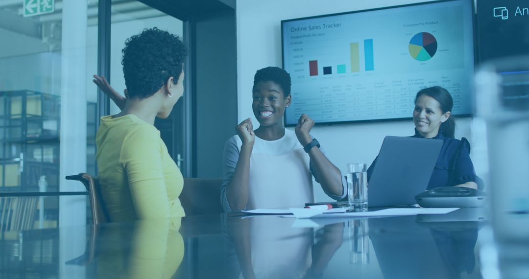 Diverse Business Team Celebrating Success with Digital Data