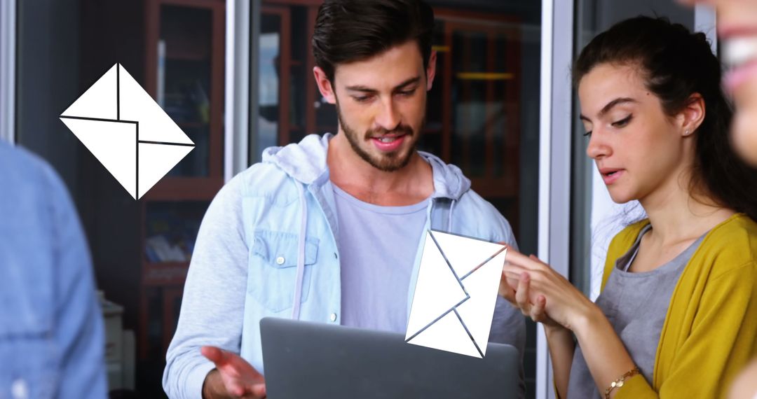 Coworkers Collaborating in Office with Digital Message Icons