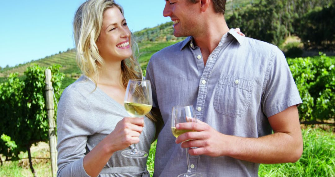 Happy Couple Enjoying Wine Tasting at Vineyard