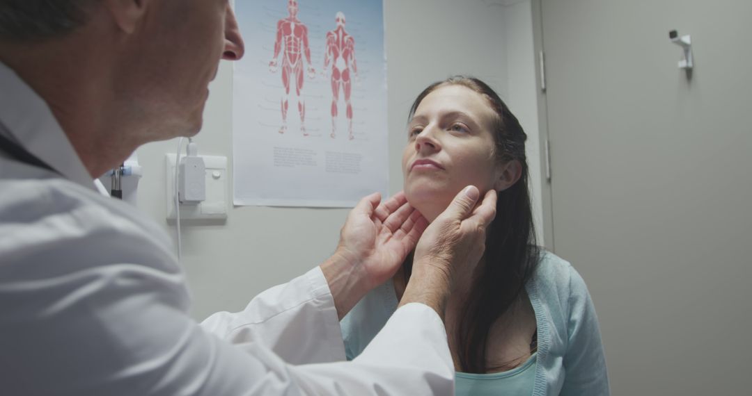 Doctor examining patient's neck in medical office - Free Images, Stock Photos and Pictures on Pikwizard.com