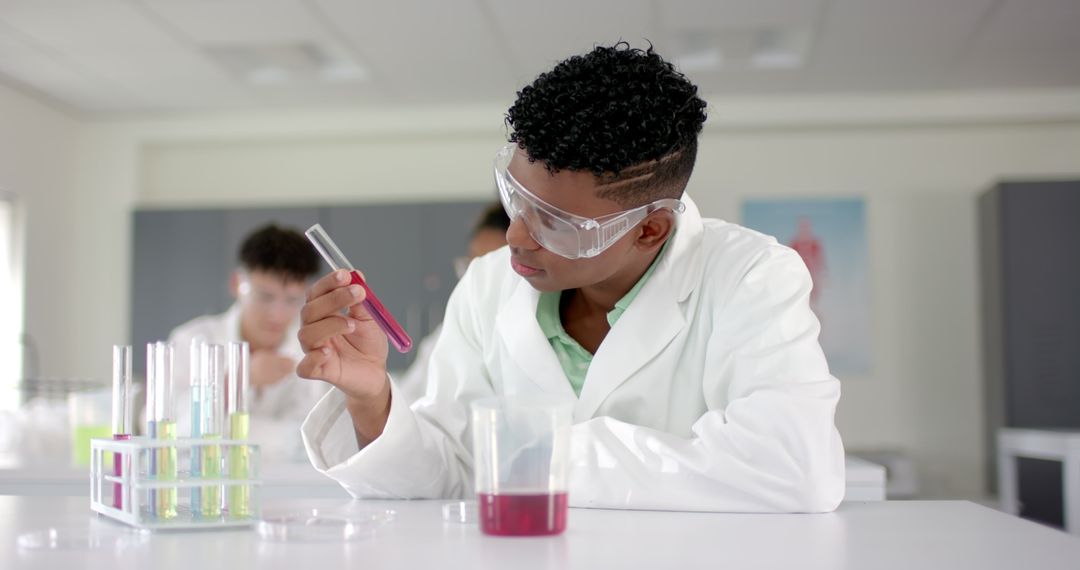 Focused High School Student Conducts Science Experiment in Lab