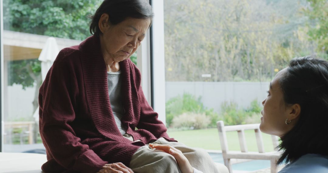 Elderly Woman Receiving Support from Young Caregiver - Free Images, Stock Photos and Pictures on Pikwizard.com